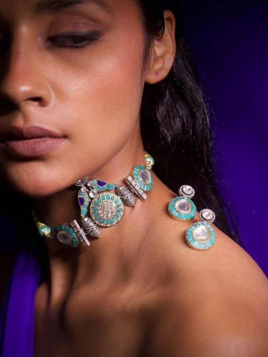 Woman wearing 92.5 silver tessellation choker and turquoise enamel studs on shoulder