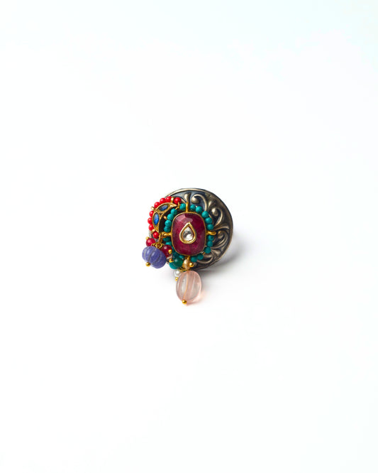 Magenta Core Ring in 925 silver with magenta centre stone, turquoise bead border, teardrop highlight, and clustered detailing