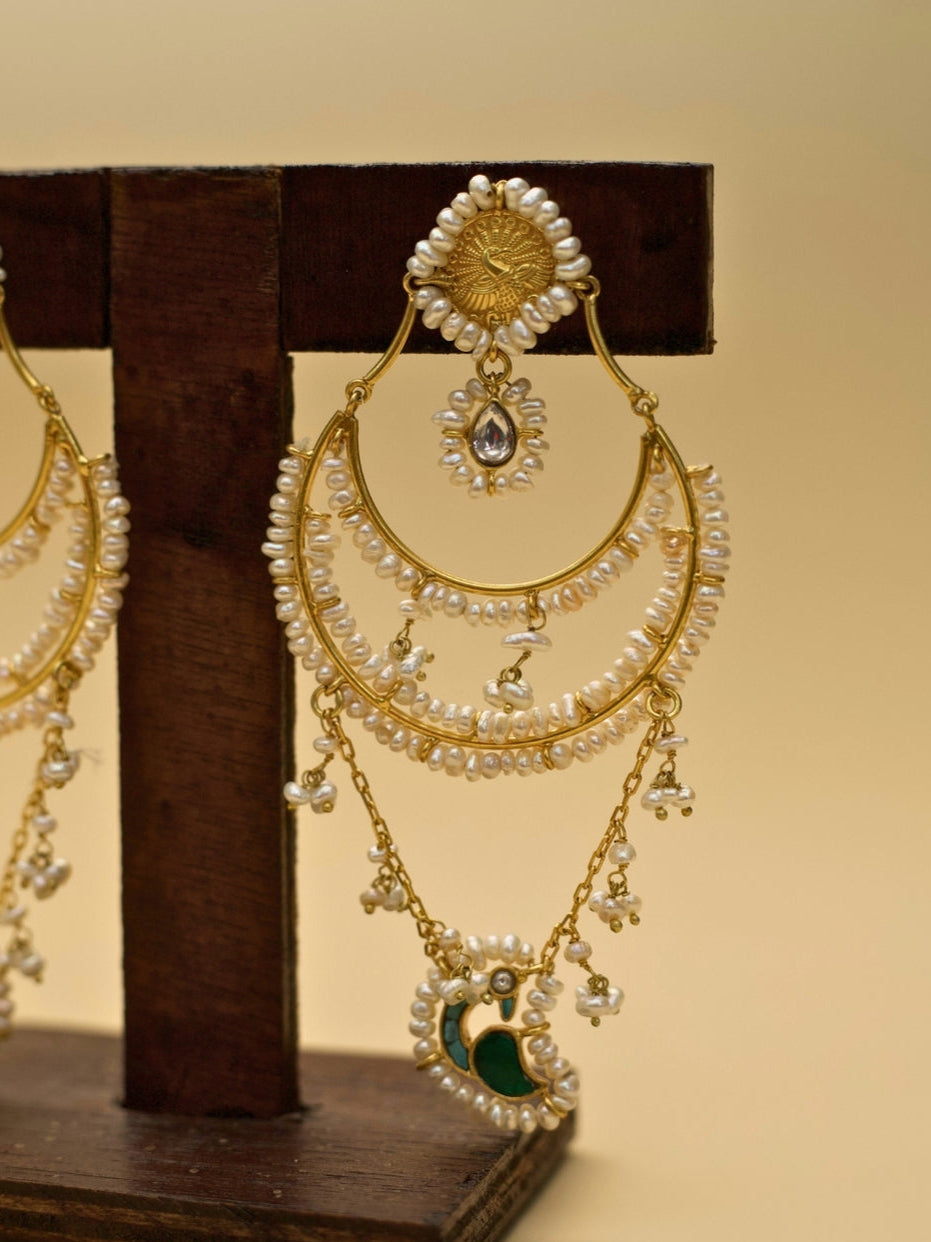 Chaand Re Jhumkas by Naksa—gold polished 925 silver earrings with layered pearl chains, green crescent drop, and faceted teardrop stone.