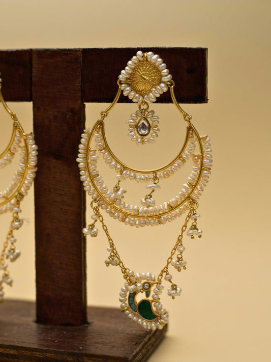 Chaand Re Jhumkas by Naksa—gold polished 925 silver earrings with layered pearl chains, green crescent drop, and faceted teardrop stone.