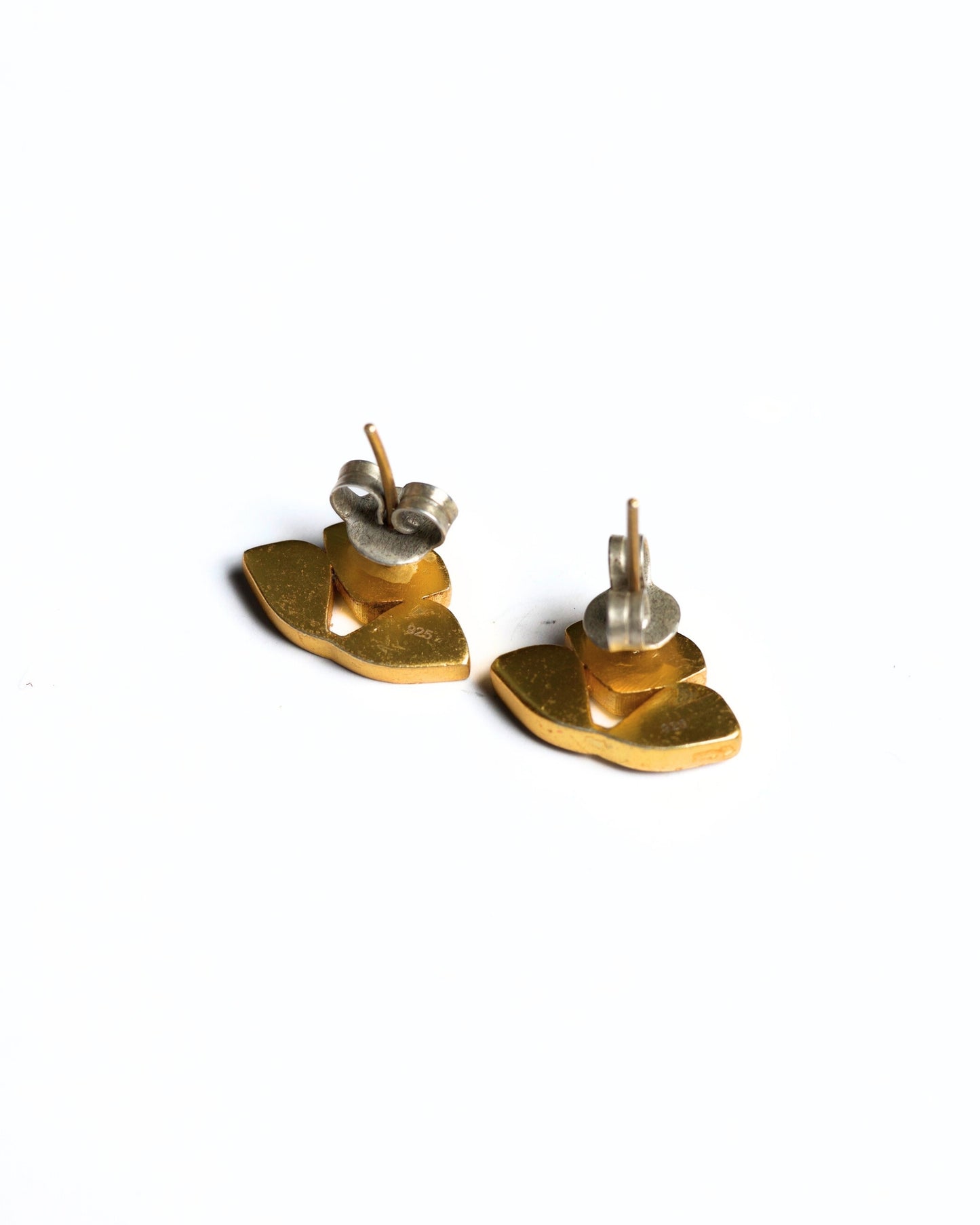 Gold-polished silver studs with red petal-shaped stones