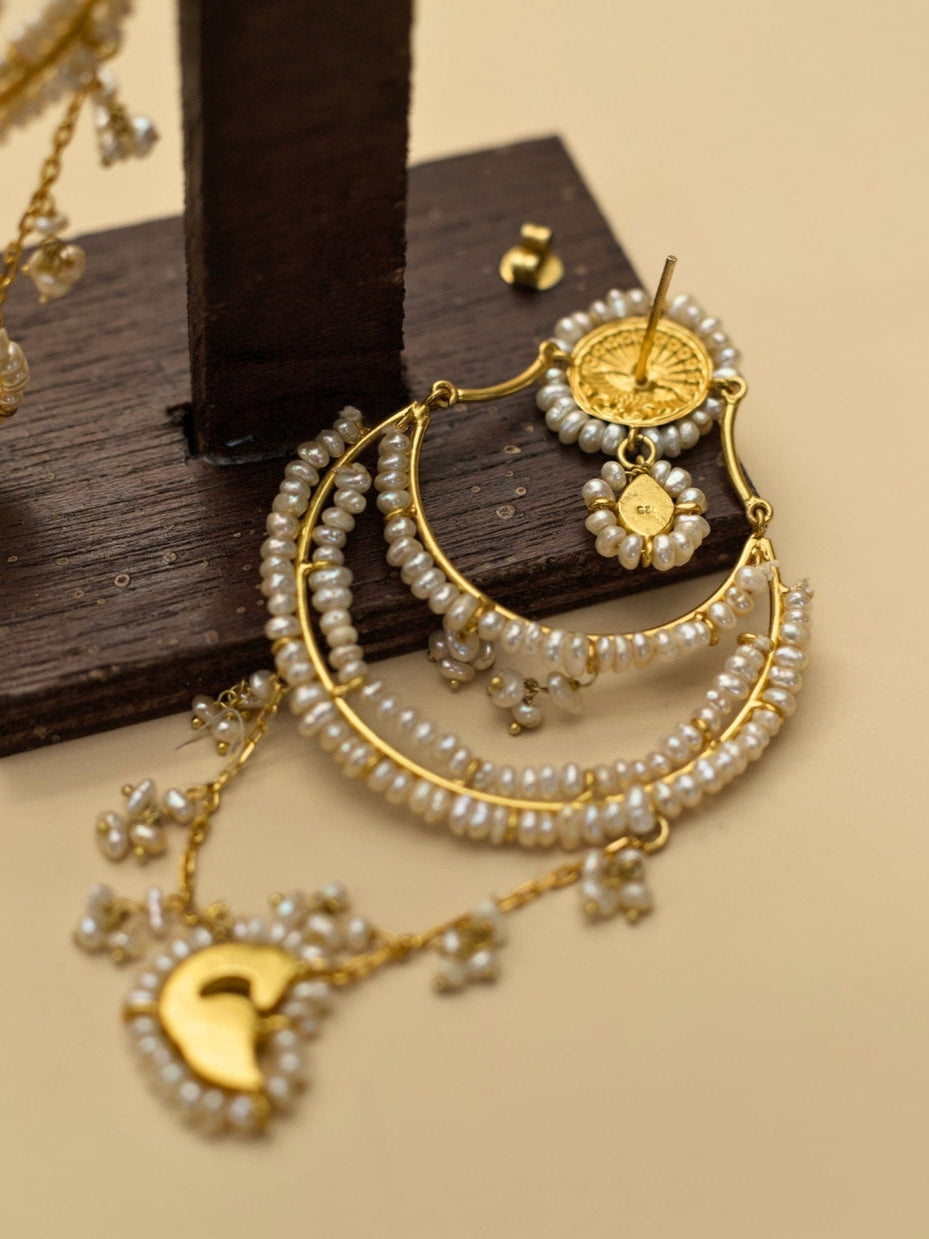 Chaand Re Jhumkas by Naksa—gold polished 925 silver earrings with layered pearl chains, green crescent drop, and faceted teardrop stone.
