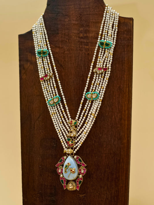 Kahaniyon Ki Maala by Naksa—multi-strand pearl haar in 925 silver with enamel tikras, hand-painted floral pendant, and miniature motif accents.