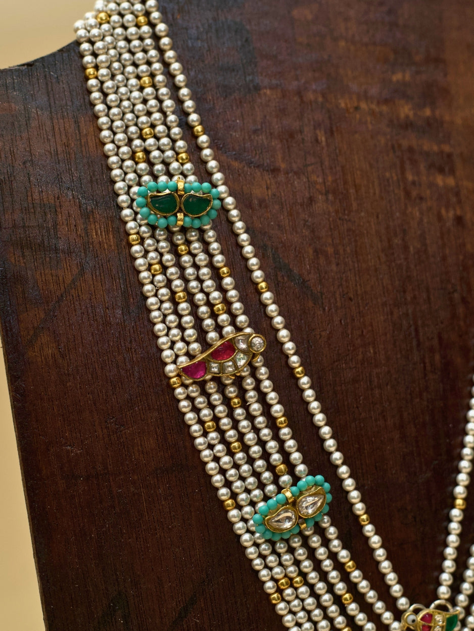 Kahaniyon Ki Maala by Naksa—multi-strand pearl haar in 925 silver with enamel tikras, hand-painted floral pendant, and miniature motif accents.