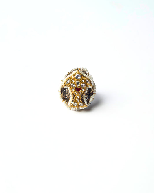 Pure 925 silver ring with kundan fish emblem at the centre, framed by pearl detailing in an oval medallion form