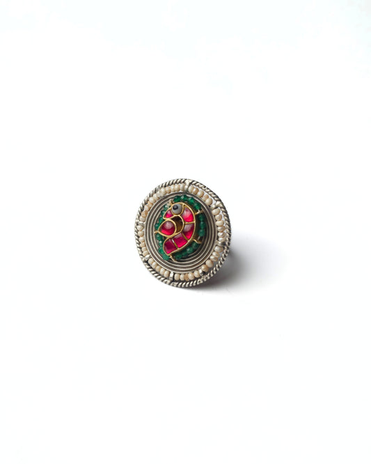 Bird Coil Ring in 925 silver with kundan-style bird motif, circular silver coils, pearl border, and green detailing