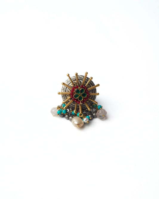 Sunburst Crest Ring in 925 silver with gold sunburst spokes, green floral centre, red bead detailing, and pearl drops