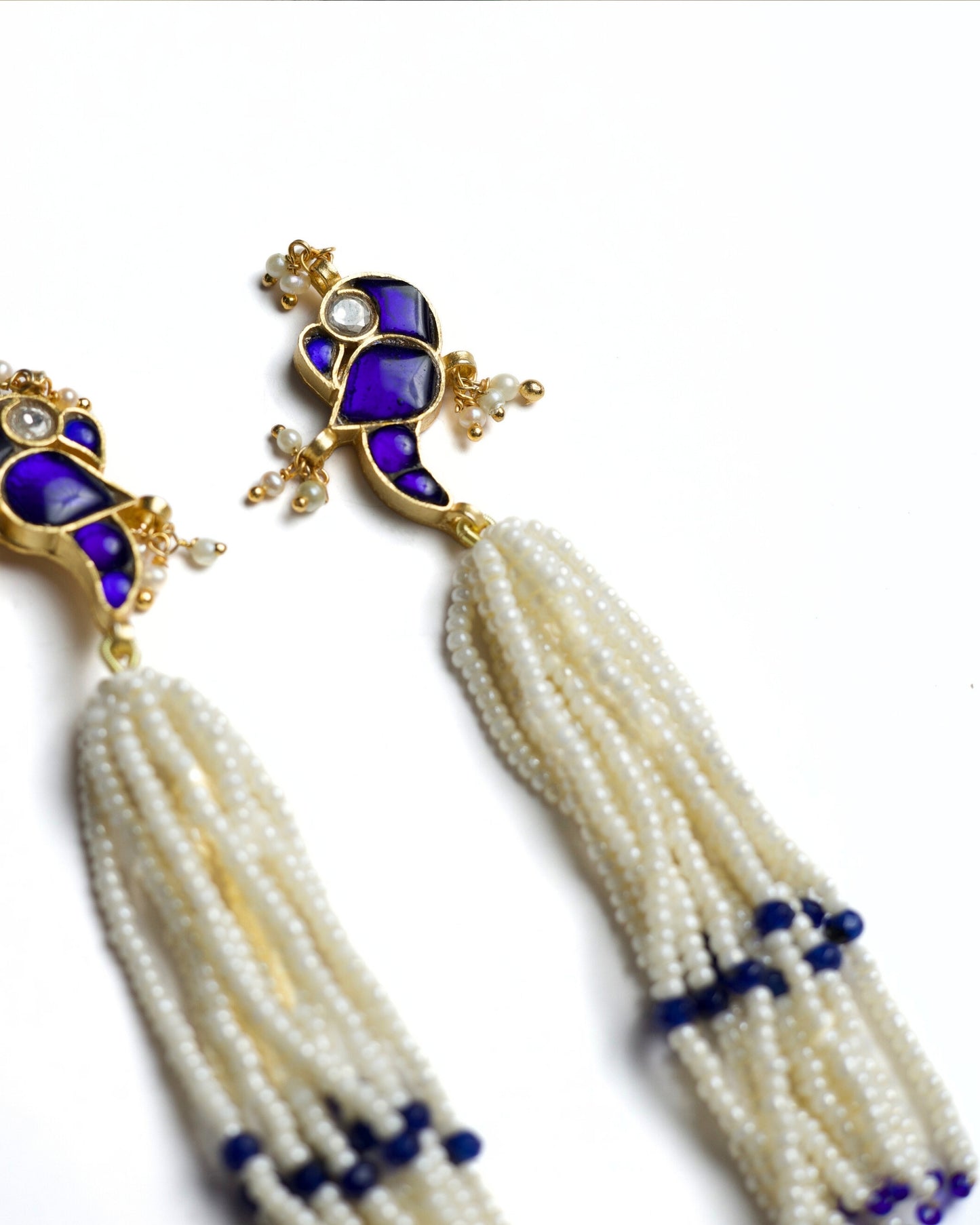 Gold-polished silver earrings with indigo enamel and pearl tassels
