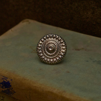 Literature and jewellery have the power to alter lives. Express your unyielding spirit with our pure oxidised silver ring with a spiral engraved pattern symbolising the ripples of hope in stagnant waters. It has an adjustable pure silver band for the perfect fit which makes it an ideal everyday wear jewellery.
