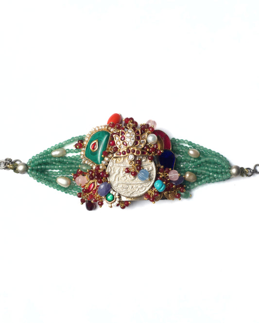Convertible bracelet in pure 925 silver featuring an Urdu-script engraved coin, lotus kundan detailing, green faceted beads, and pearl accents