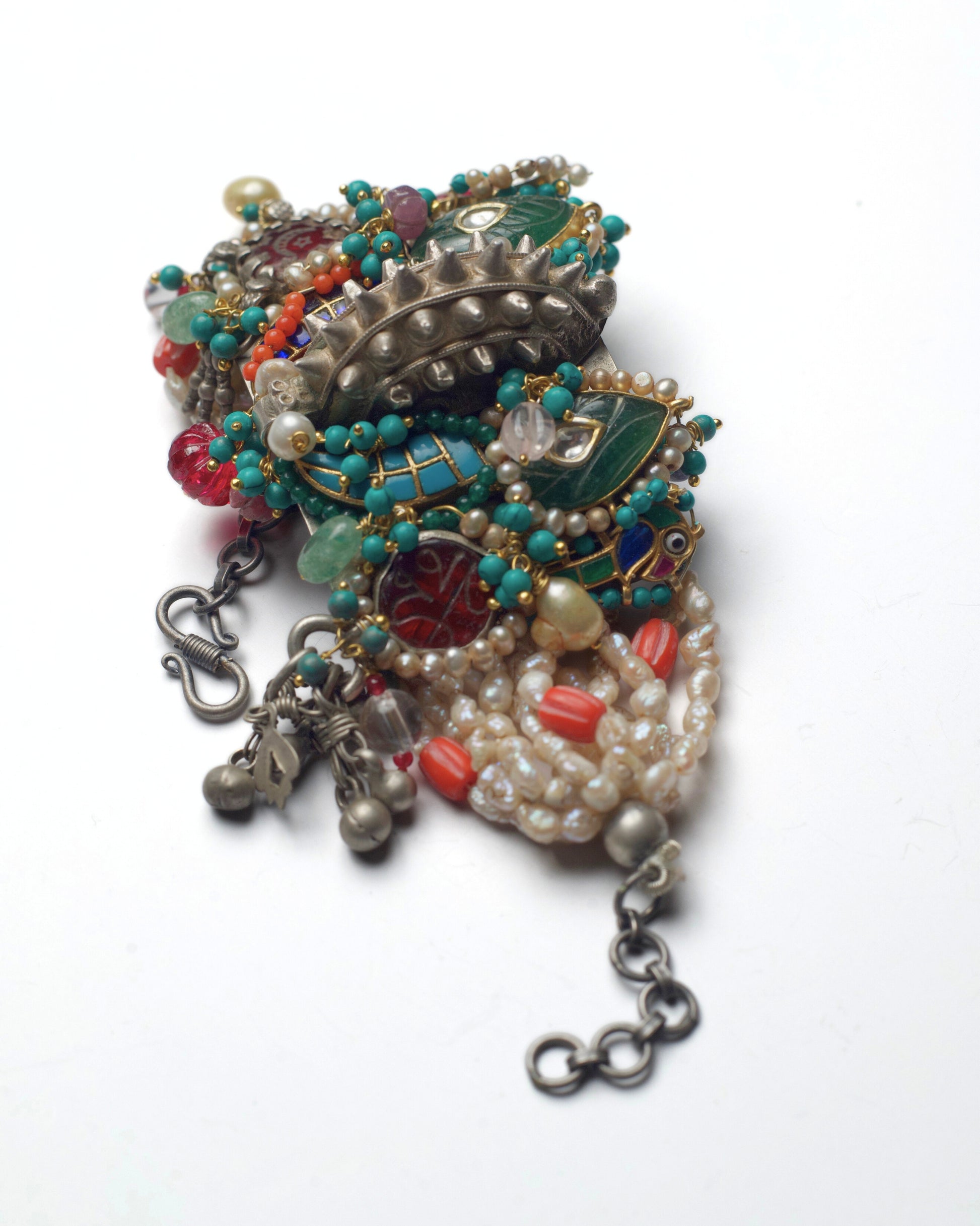 Side view of Central Relic convertible bracelet showcasing layered pearl rows, turquoise accents, and gold-polished kundan settings