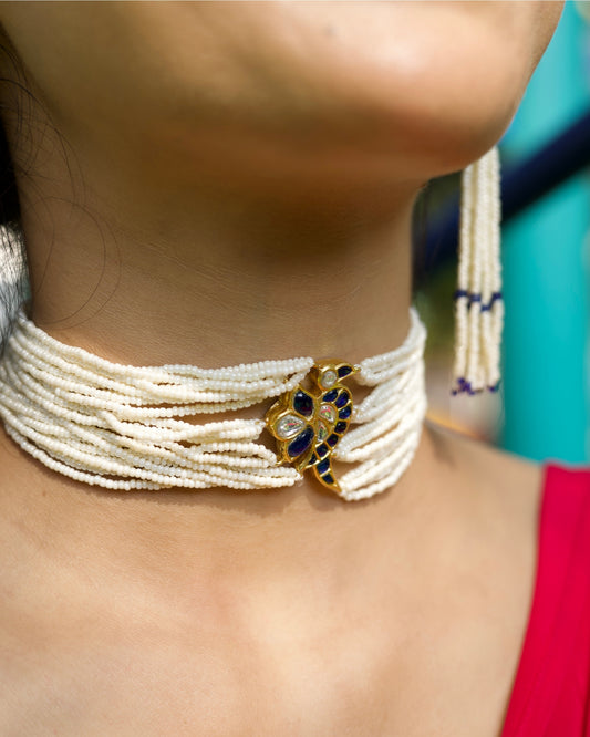 Layered pearl choker with gold-polished silver bird motif