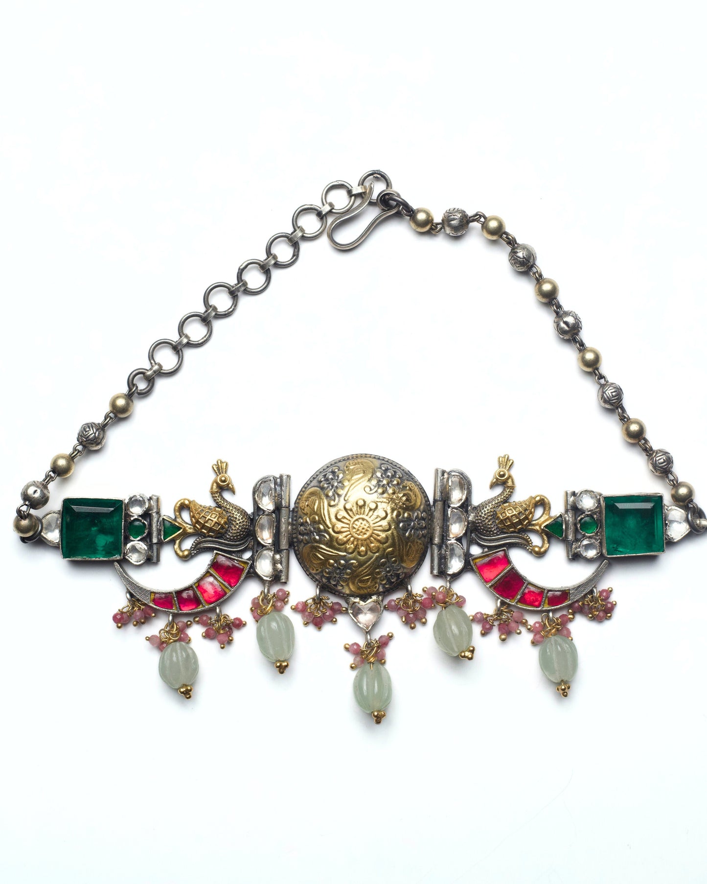 Full view of the dual-tone dotted medallion with kundan-style detailing at the centre of The Peacock Halo Choker in pure 925 silver.