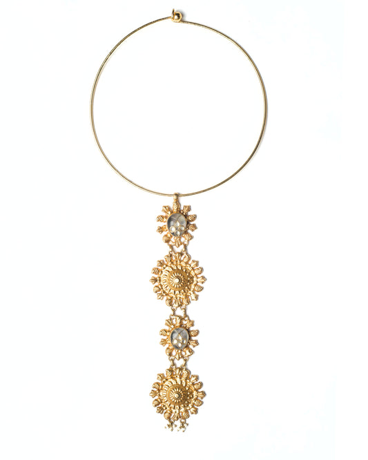 Gold-toned hasli necklace with vertical solar rosette drop and kundan-set detailing