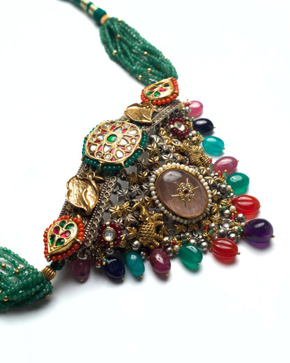Side detail of choker featuring elephant motifs and hand-set stones
