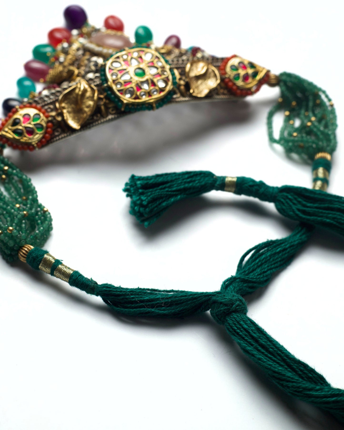 Dori of baroque choker showing golden shell accents, pink stones, and oxidised silver detailing