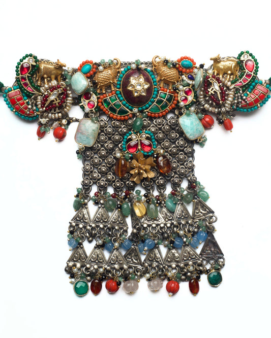 Monumental fusion choker with elephant motifs, kundan centre, oxidised lattice panel, and triangular stone drops in 925 silver