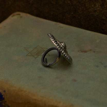 Literature and jewellery have the power to alter lives. Express your unyielding spirit with our pure oxidised silver ring with a spiral engraved pattern symbolising the ripples of hope in stagnant waters. It has an adjustable pure silver band for the perfect fit which makes it an ideal everyday wear jewellery.