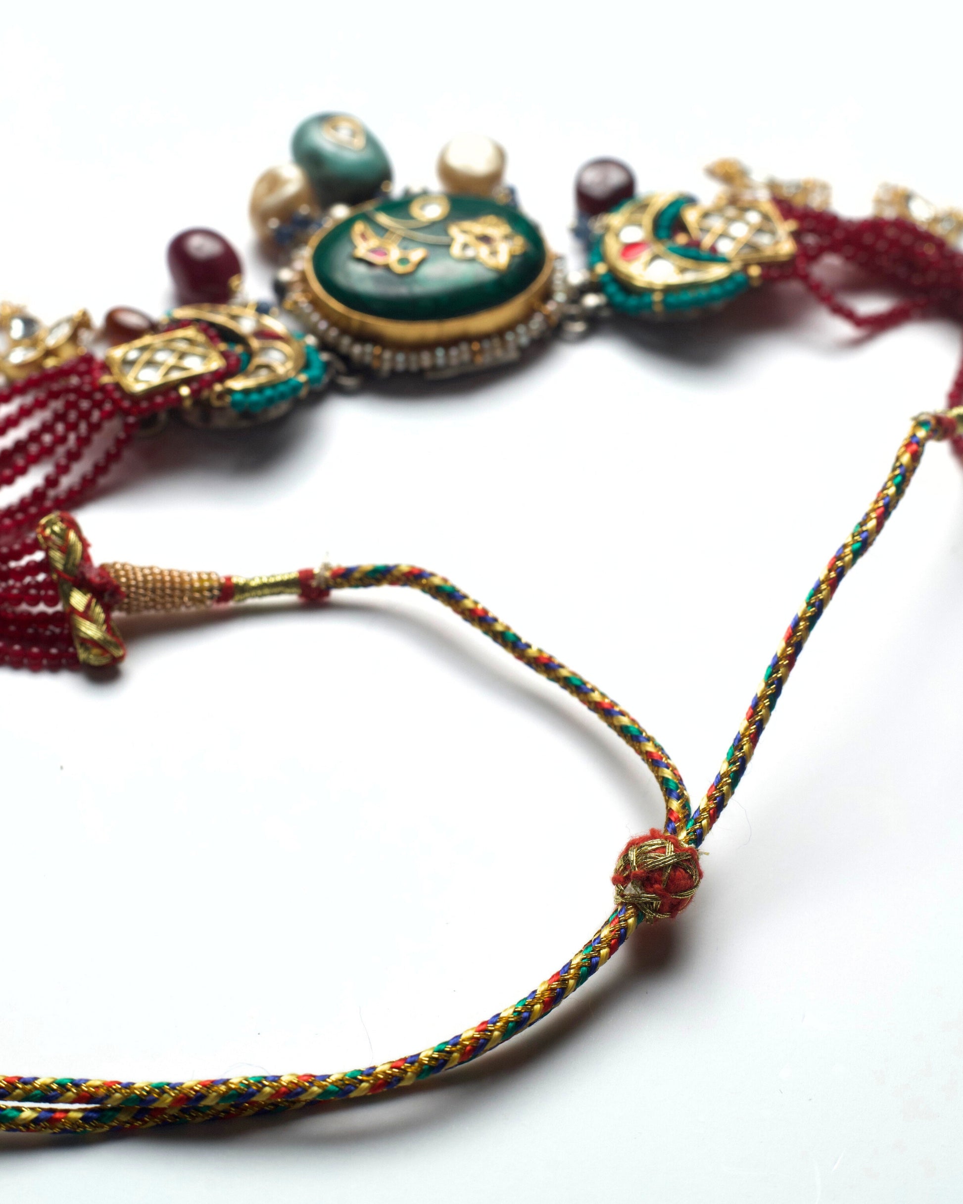Artisan silver kundan choker with green bird motif centre, turquoise accents and layered drops