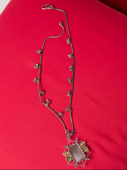 Pure silver necklace with carved salmon gemstone, kundan navratna detailing, gold parrots and bead accents