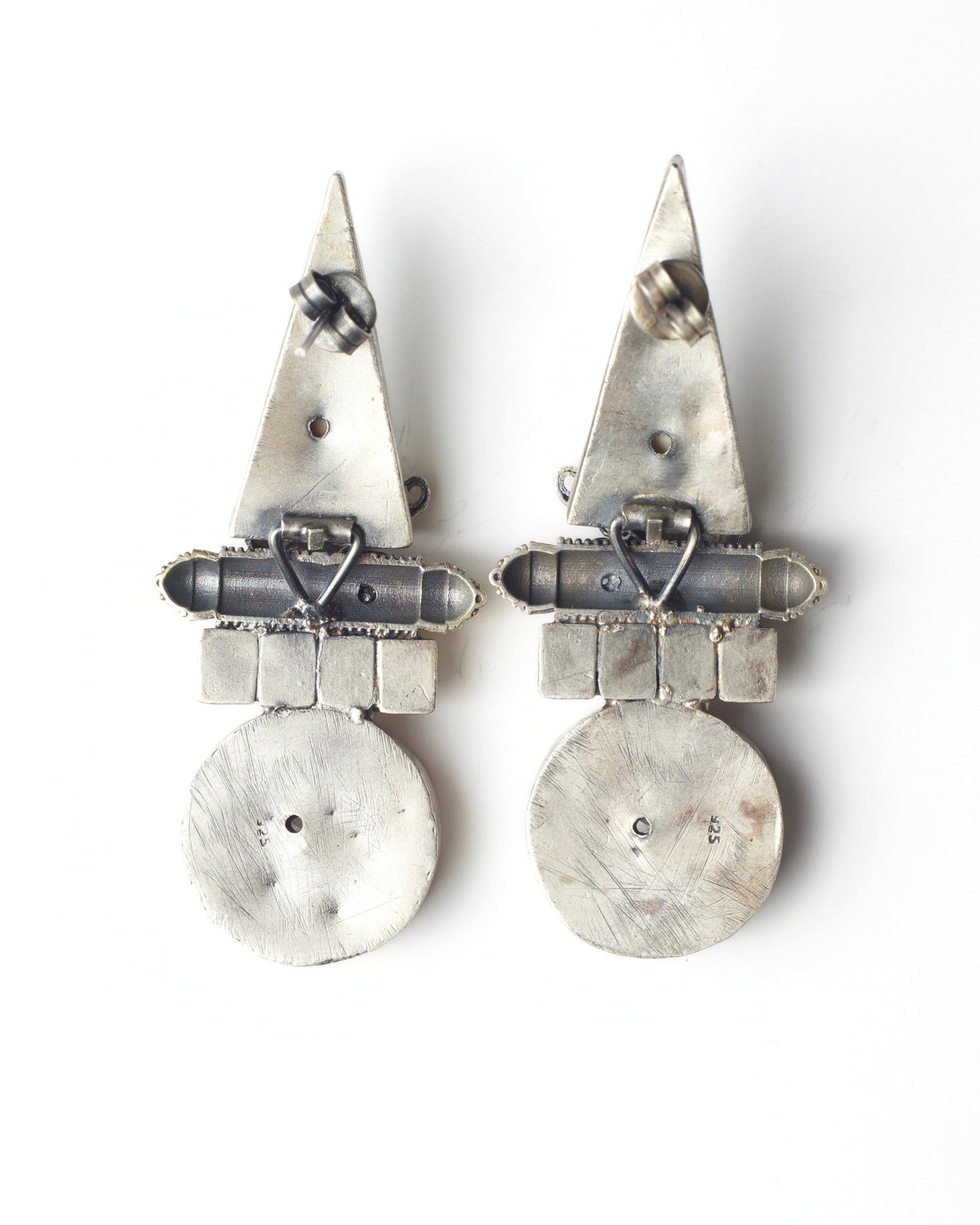 Back of red stone silver earrings with elephant detailing