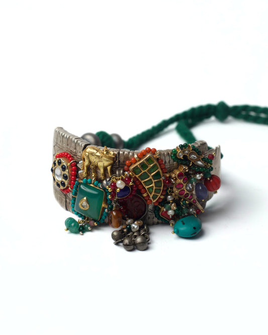 Tusker Patchwork Choker handcrafted in silver with chatai base, tusker motif, kundan detailing, carved stones, parrot accents, and ghunghroo drops