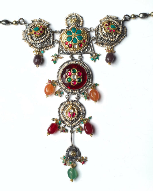 Red stacked heirloom necklace choker in oxidised silver with kundan floral motifs, pearl borders, parrot details, and multicolour stone drops