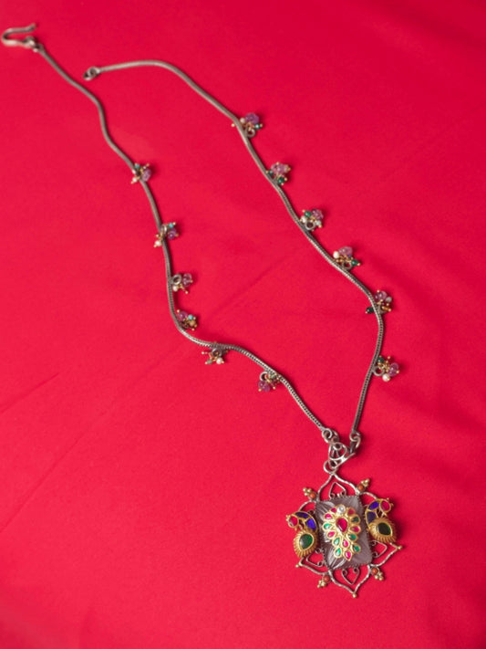 Pure silver necklace with carved salmon gemstone, kundan navratna detailing, gold parrots and bead accents