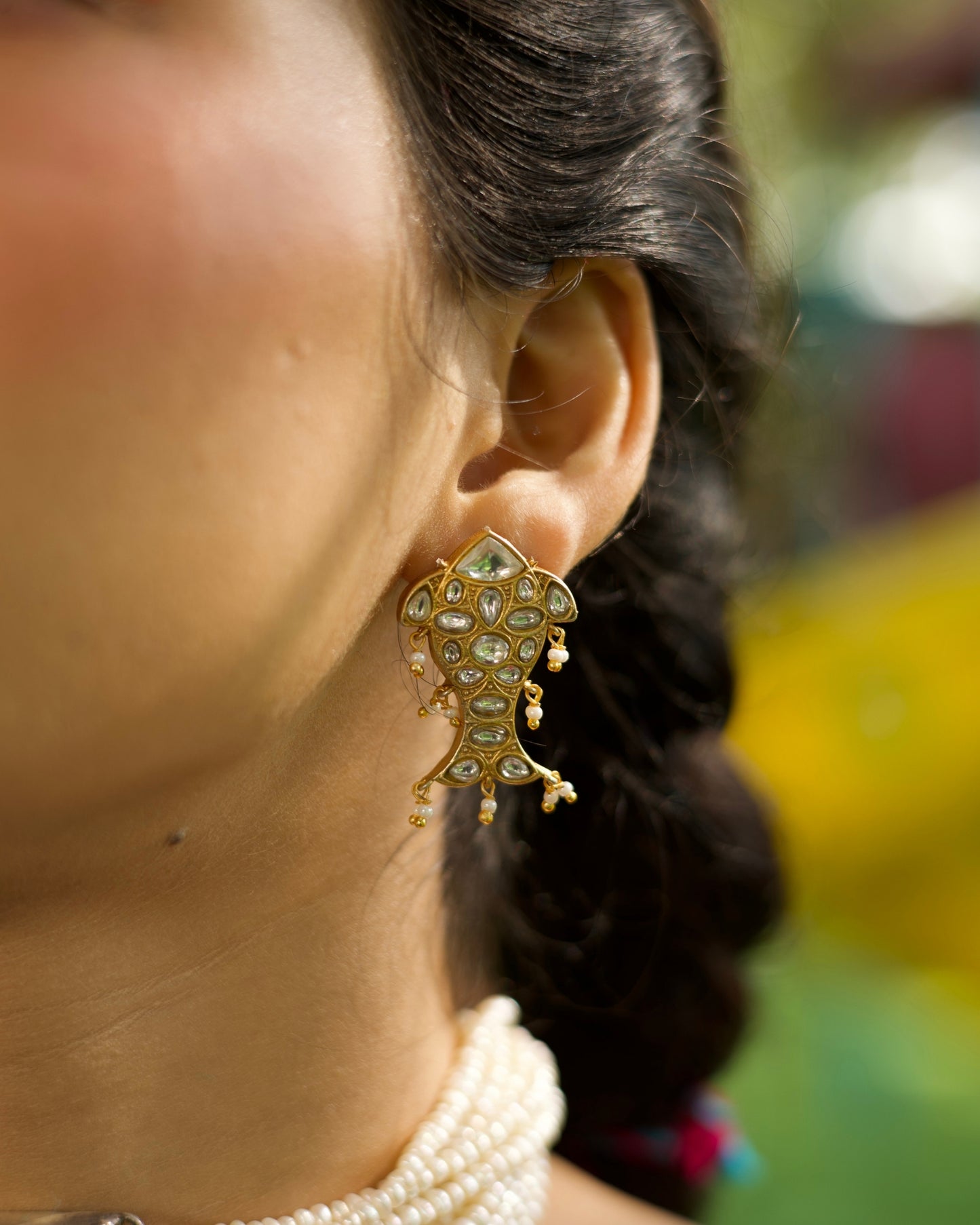 925 silver fish-shaped stud earrings with kundan-style stones and small pearl drops, gold-polished finish, playful festive design.