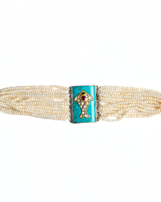 Layered pearl choker in 925 silver with turquoise rectangular centre and fish motif set with kundan-style white stones and red accent.