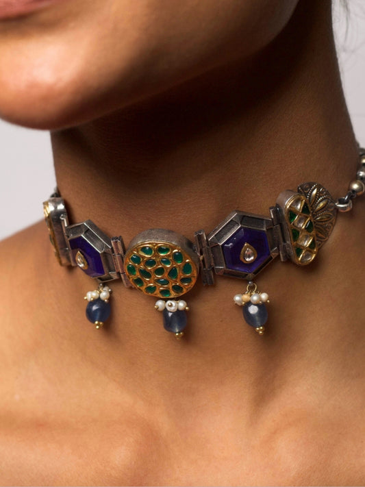 92.5 silver choker necklace with geometric blue enamel, green kundan motifs, and pearl-tipped blue drops; fusion statement jewelry from Naksa.