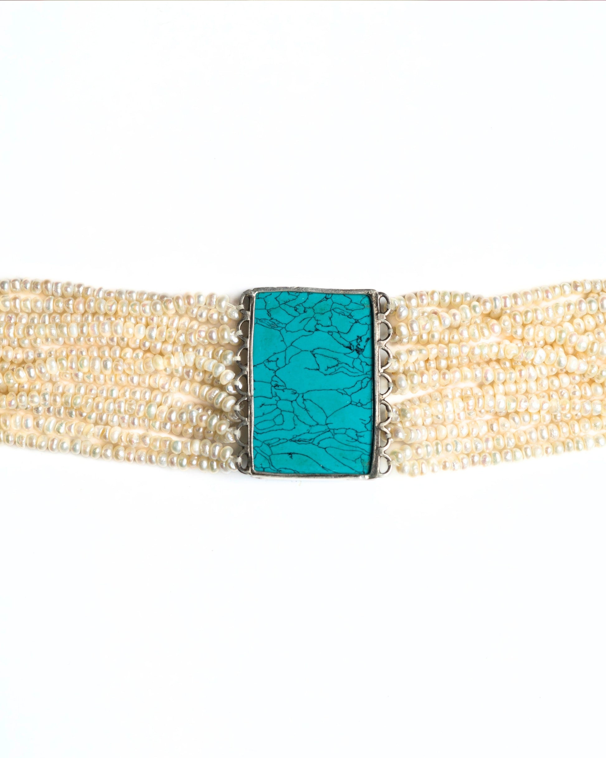 Layered pearl choker in 925 silver with turquoise rectangular centre and fish motif set with kundan-style white stones and red accent.