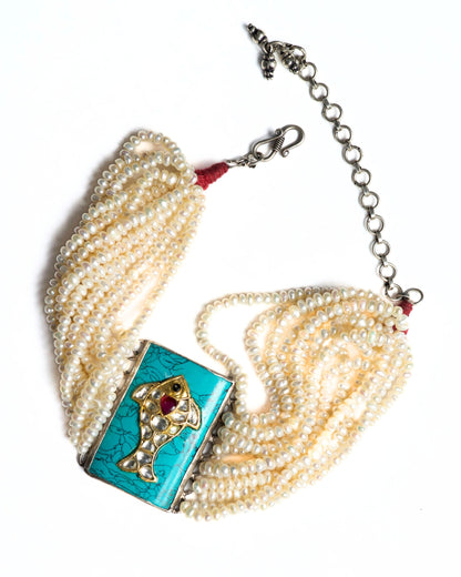 Layered pearl choker in 925 silver with turquoise rectangular centre and fish motif set with kundan-style white stones and red accent.