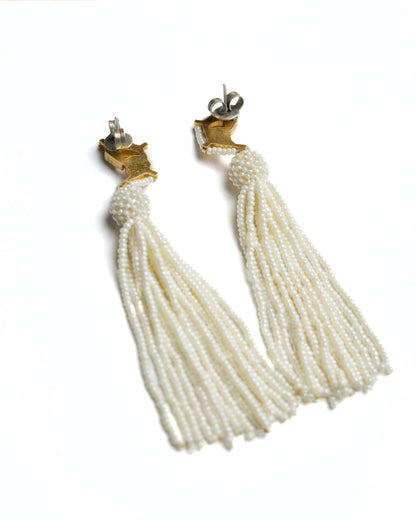 Gold-toned 925 silver bird earrings with kundan-style stones and long cascading pearl tassels.