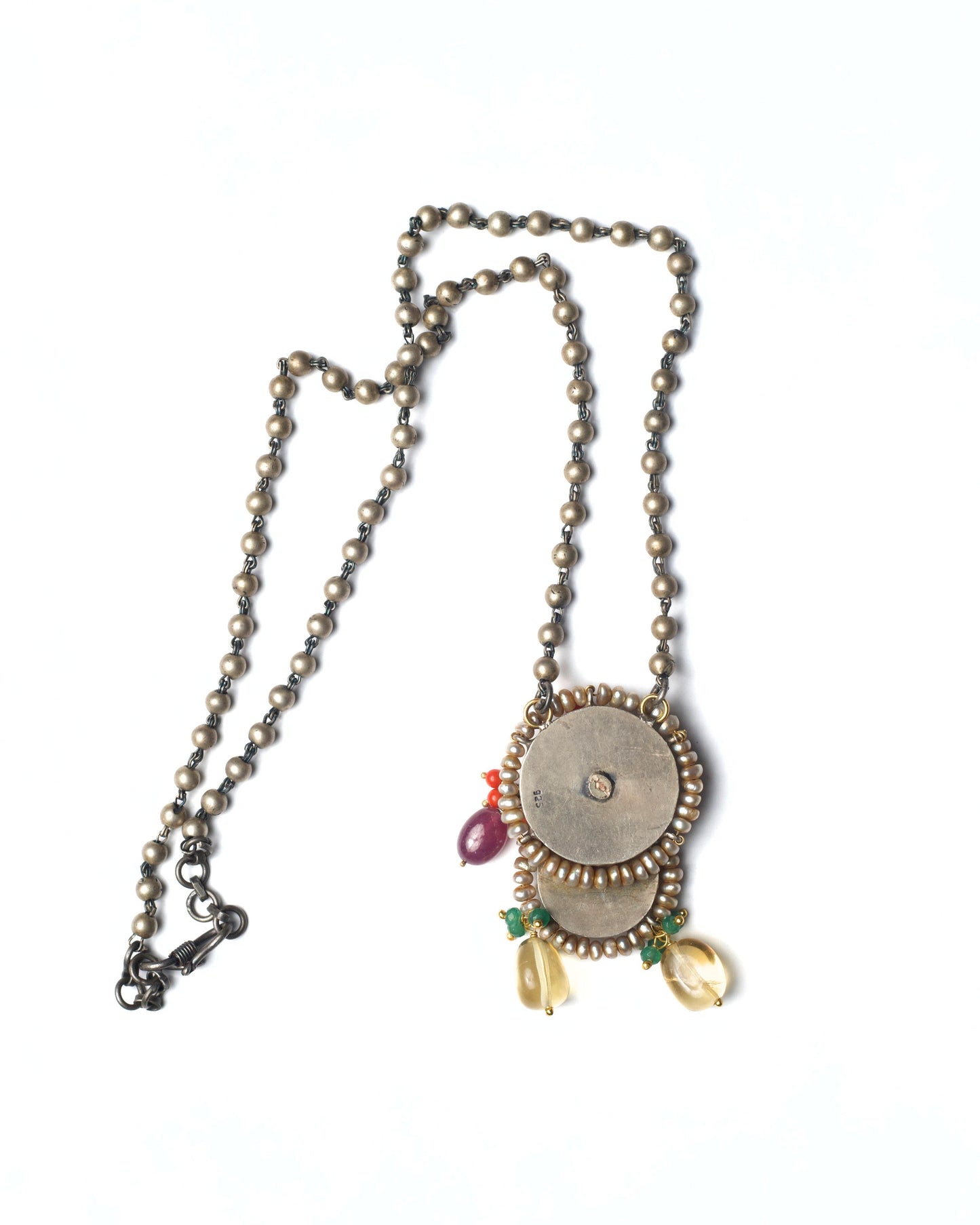 Back view of Rustwing Coin Necklace showing layered coin construction and chain detailing in oxidised silver