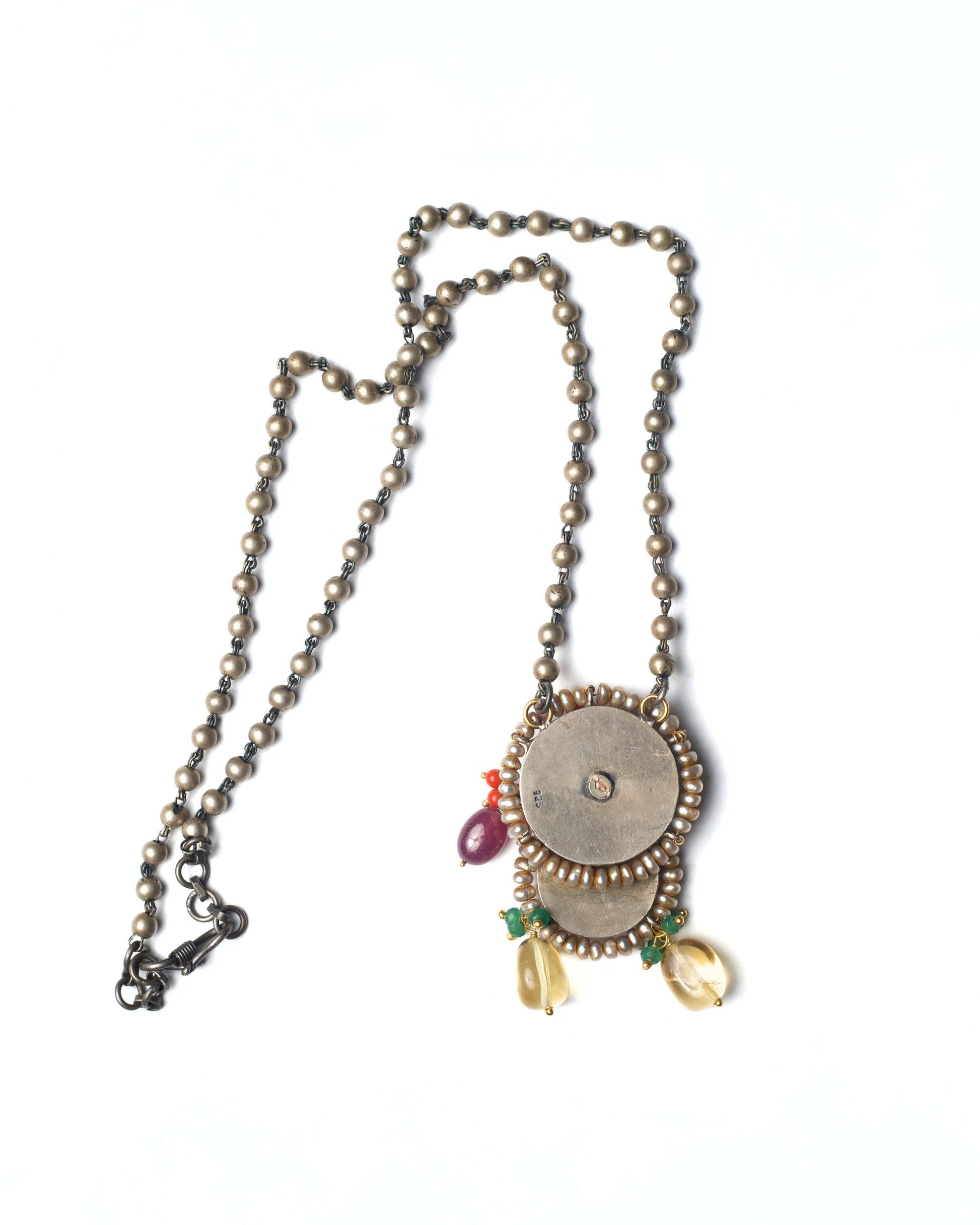 Back view of Rustwing Coin Necklace showing layered coin construction and chain detailing in oxidised silver