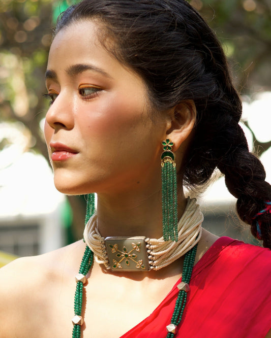 Green stone tassel earrings in 925 silver with gold polish, featuring floral stud top and cascading emerald bead strands.