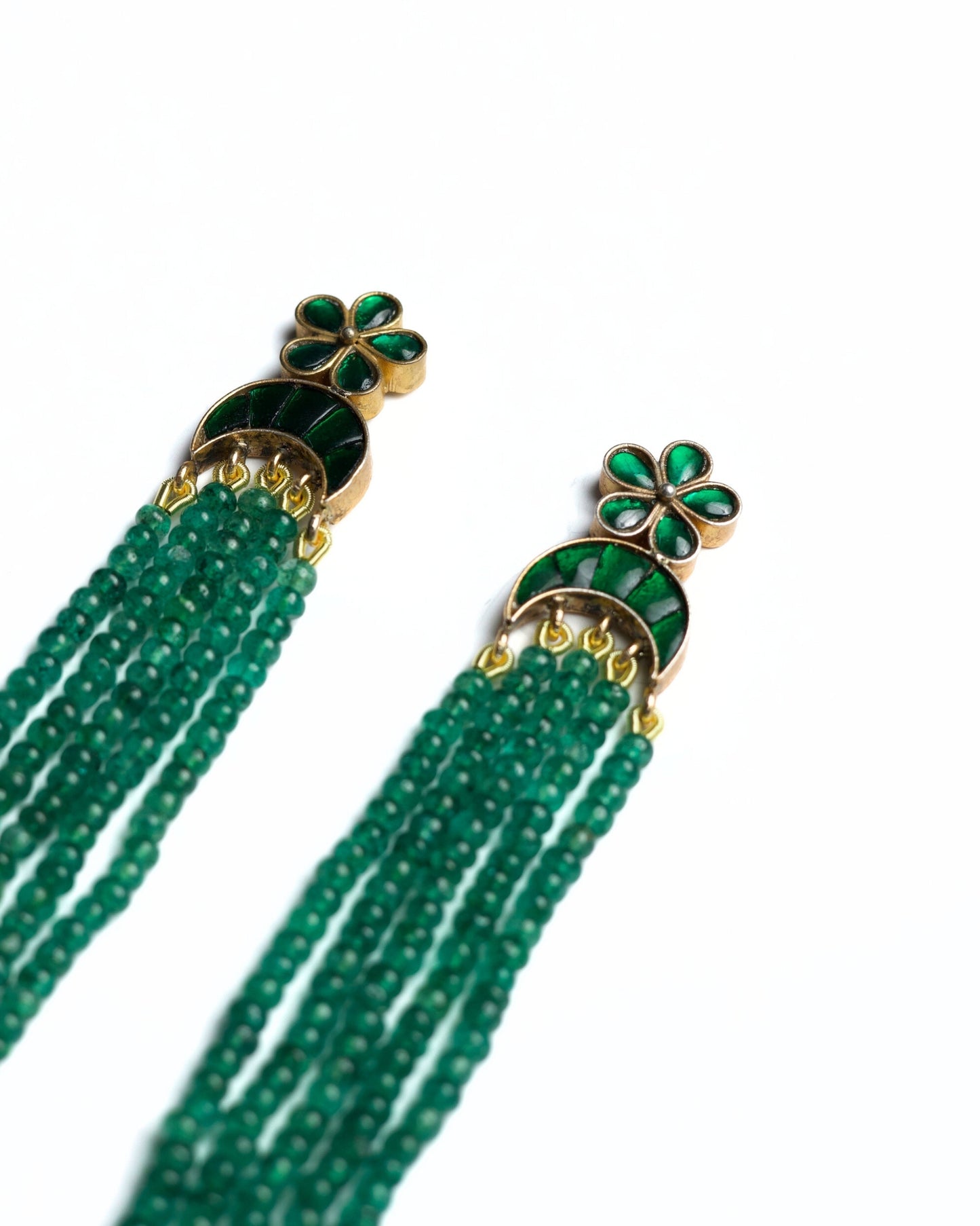 Green stone tassel earrings in 925 silver with gold polish, featuring floral stud top and cascading emerald bead strands.