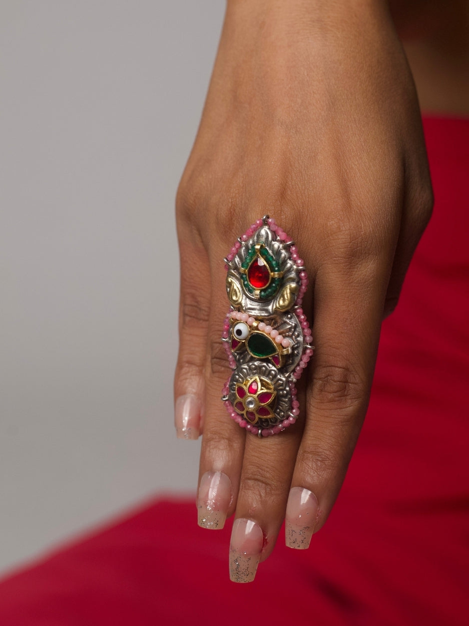 Handcrafted 92.5 silver statement ring with three vertically stacked motifs—kundan bird, temple flame, and floral medallion with pink beading – Naksa
