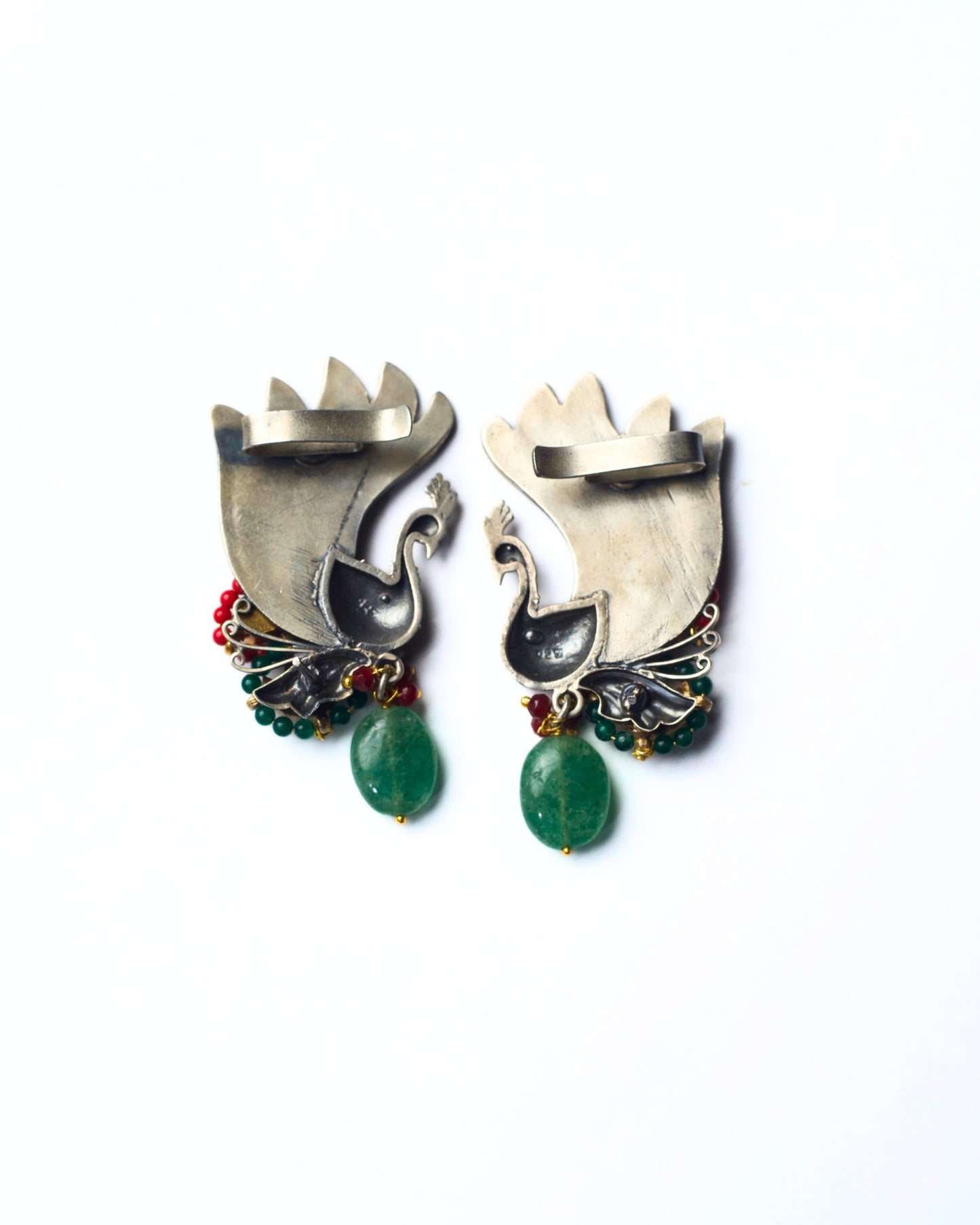 Back of 925 silver emerald wing ear cuffs with peacock detailing and stone drops