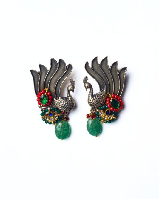 Emerald Wing ear cuffs crafted in 925 silver with winged peacock detailing, green stones, and gold-polished accents