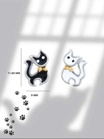 Mismatched Meows Studs by Naksa—black and white tuxedo cat earrings with golden bows, hand-enameled in pure 925 silver.