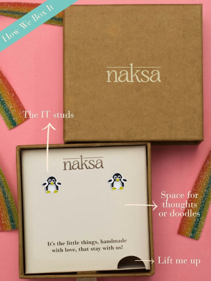 Waddle Waddle Studs by Naksa—cute penguin-shaped earrings in black, white, and yellow enamel on 925 silver, perfect for winter gifting.