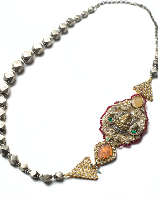 Handcrafted silver necklace with offset locket and kundan detailing