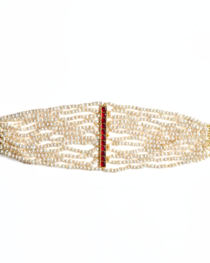 Multi-strand pearl choker in 925 silver featuring a vertical ruby-toned stone bar centre detail