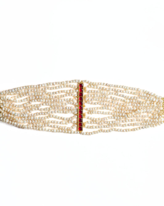 Multi-strand pearl choker in 925 silver featuring a vertical ruby-toned stone bar centre detail