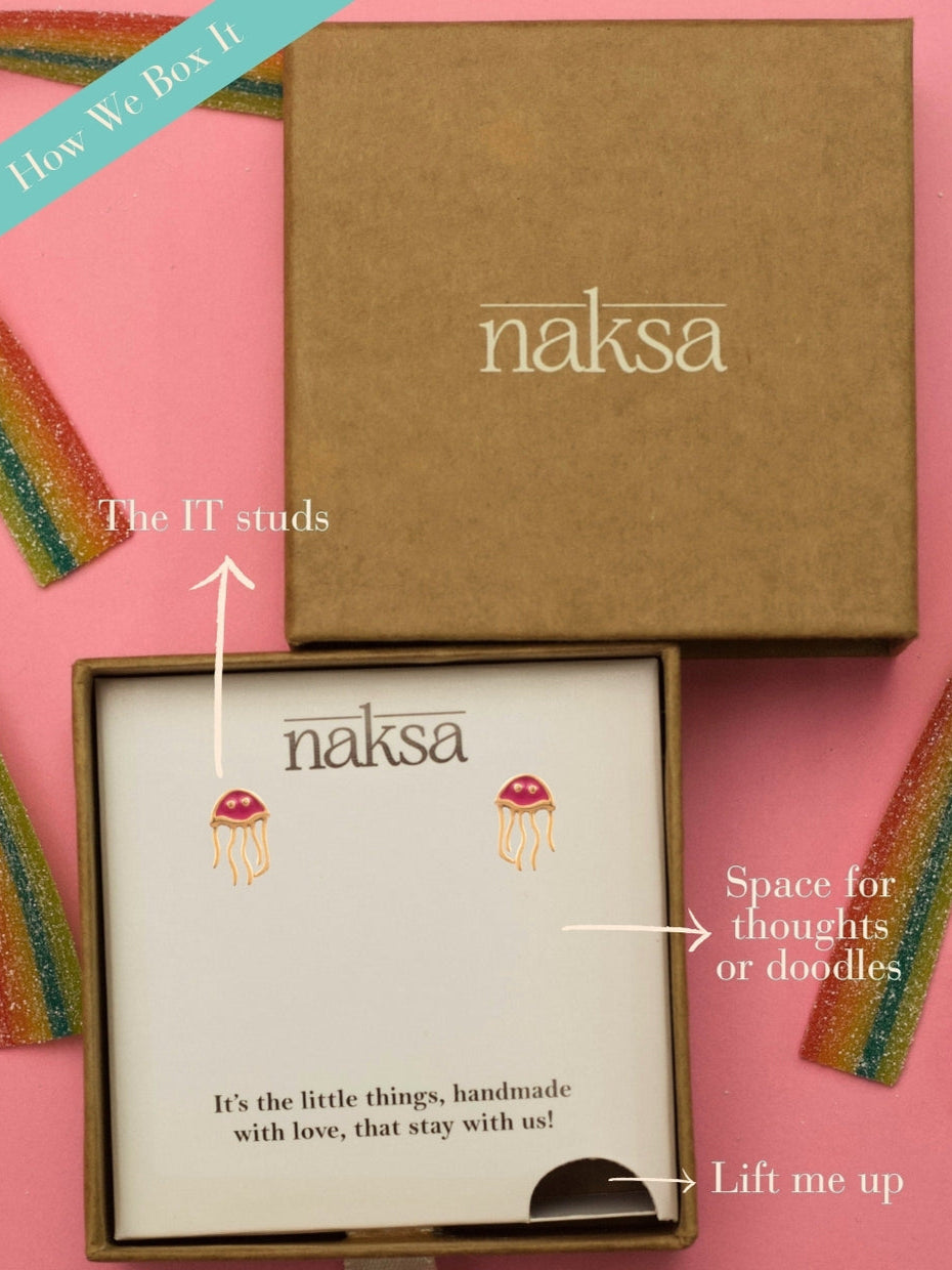 Sea You Soon Studs by Naksa—jellyfish-shaped 925 silver earrings with red enamel dome and gold-polished squiggly tentacles.
