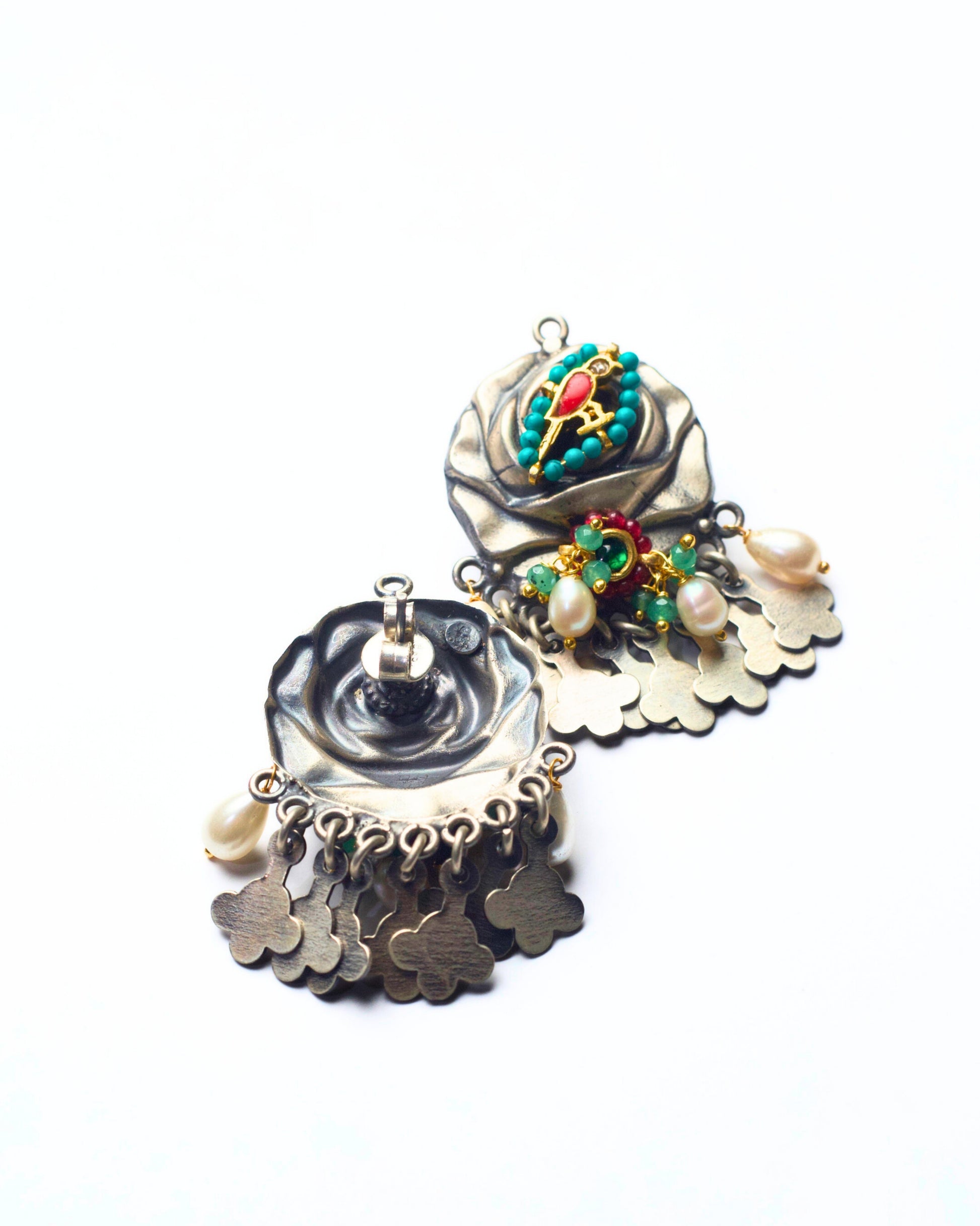 Back shot of handcrafted 925 silver fusion earrings with rose and bird motif, pearl accents, semi-precious stones, and silver fringe detailing