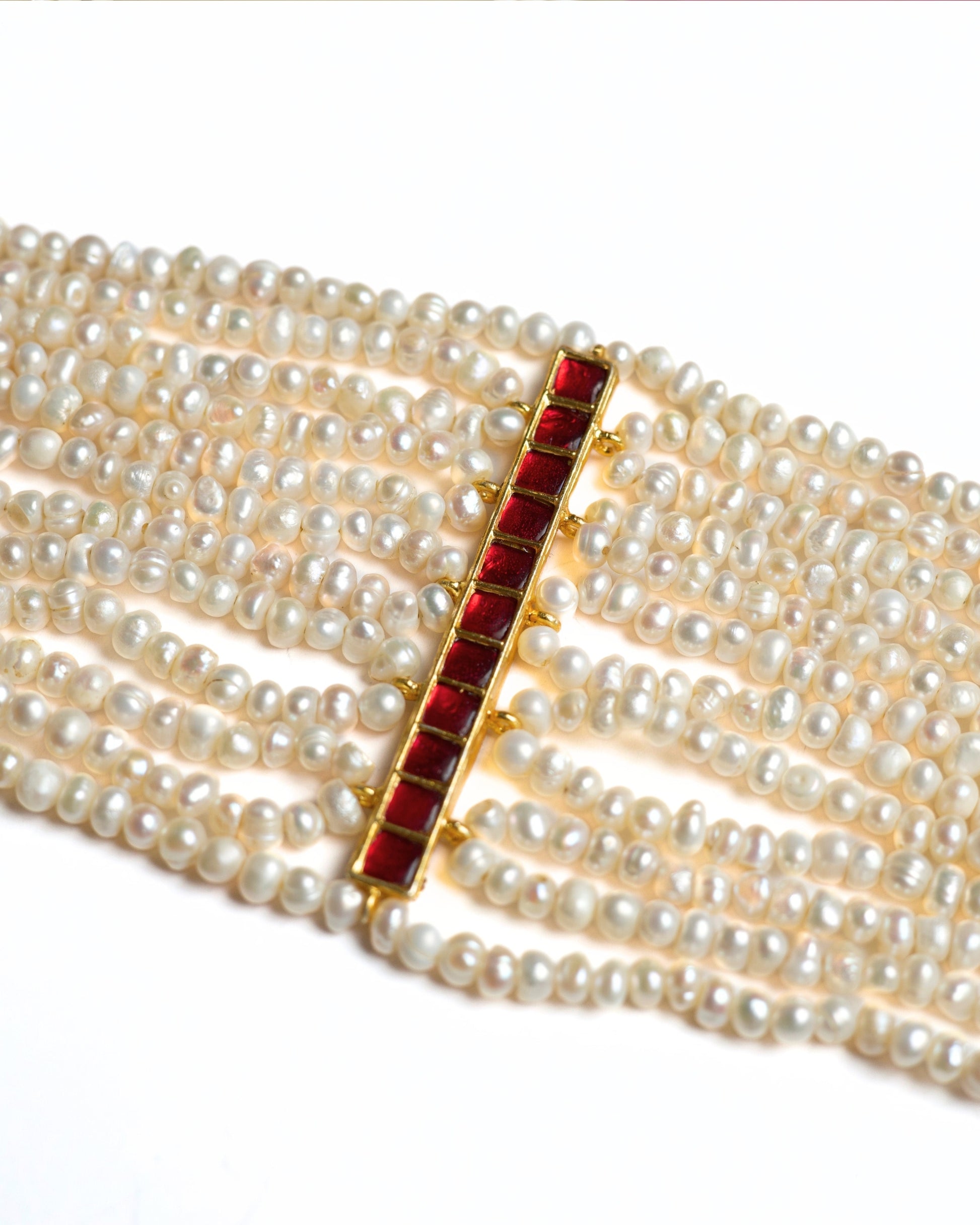 Multi-strand pearl choker in 925 silver featuring a vertical ruby-toned stone bar centre detail