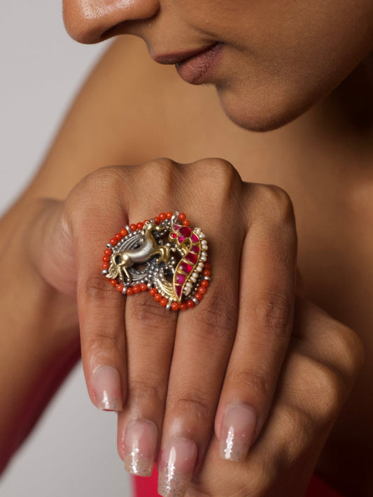 Bold 92.5 silver ring featuring horse motif with red stone flame, pearl accents, and coral border, handcrafted by Naksa.